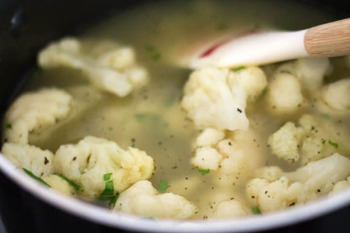 Cauliflower in a pan with stock