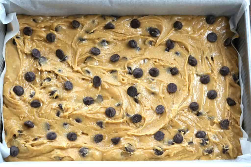 The blonie dough spread into a pan ready to bake