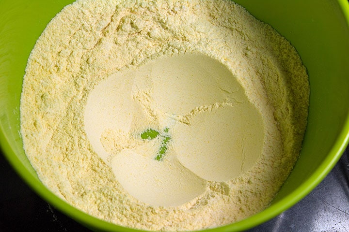 The dry ingredients in a large bowl with a well in the middle