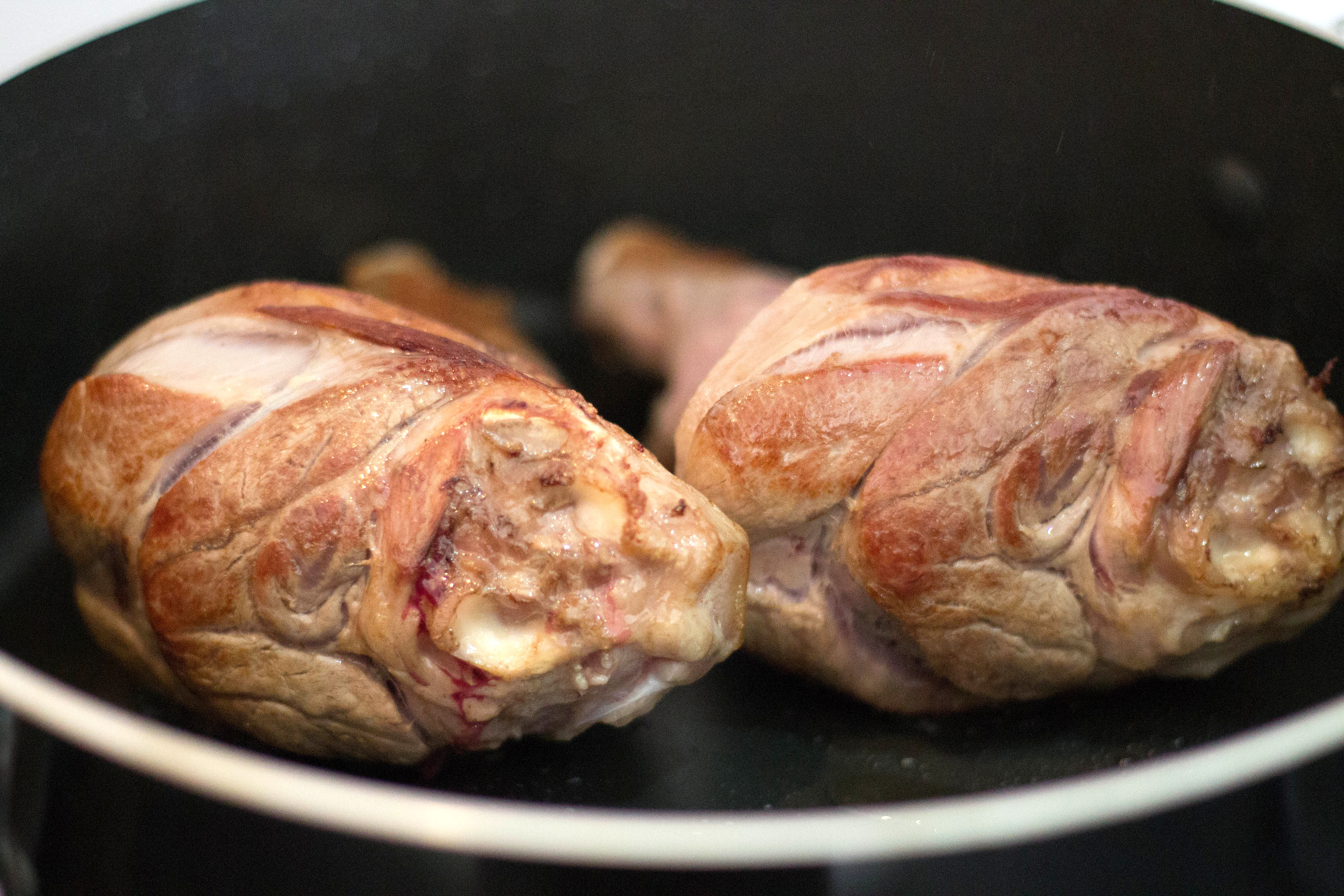 Lamb Shanks browning in a pan