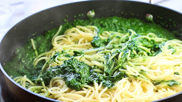 The Spaghetti added to the Spinach Sauce in the pan