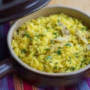 Easy One Pot Chicken and Saffron Rice in a serving dish, sprinkled with chopped parsley