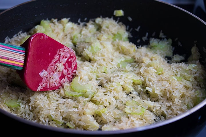 Add the rice in the pan coated with the butter.