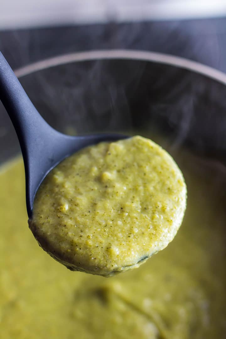 A ladle full of Healthy creamy broccoli soup