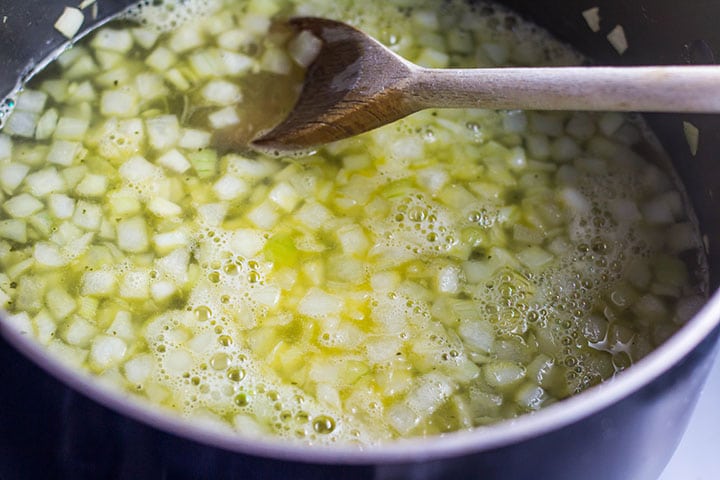 The stock added to the pan with the onions