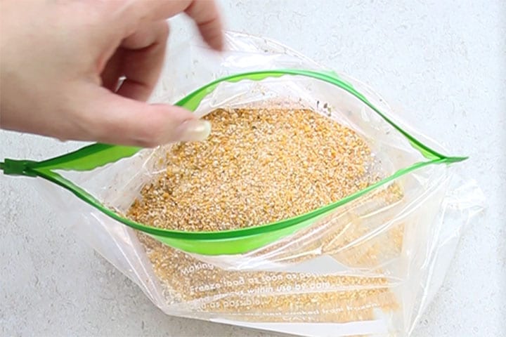 The breading mixture added to a plastic zip-lock bag