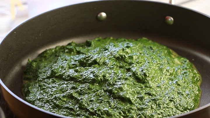 The pureed spinach mixture in a pan