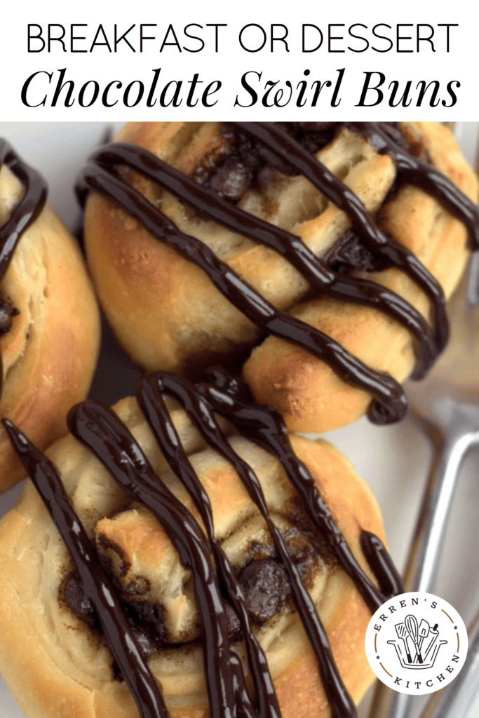 Three soft, rich, buttery buns with a chocolate and cinnamon filling and chocolate drizzled on the top.