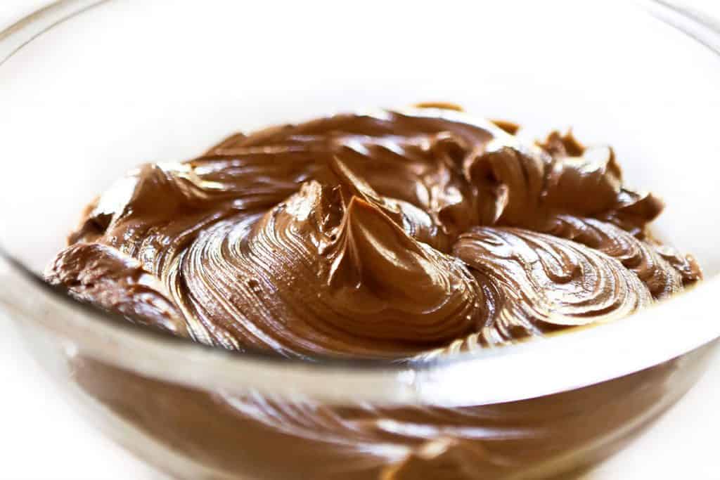 a bowl of freshly made chocolate frosting