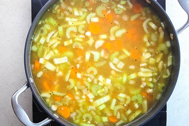 seasoning added to the soup in the pan