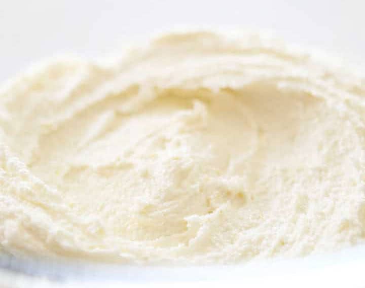 cream chead and butter whipped together in a bowl