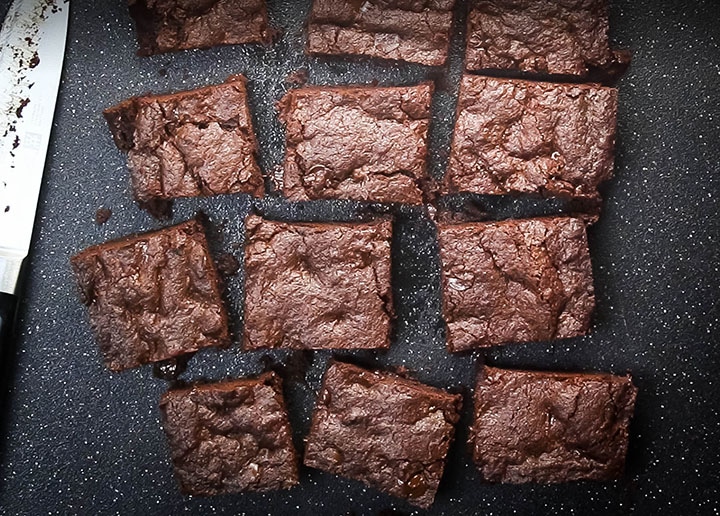 double chocolate chip cookie bars cut into squares on a cutting board
