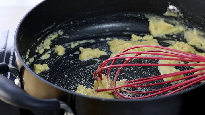 The butter flour and mustard powder mixed together in the pan