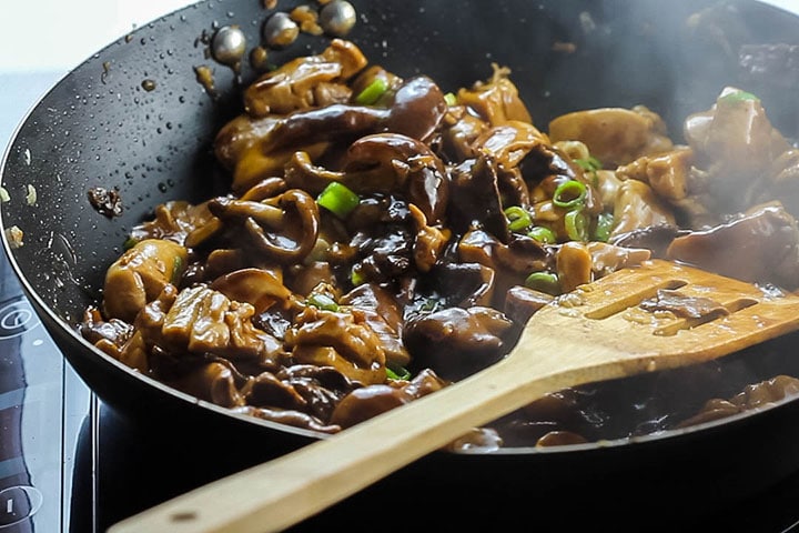 Chicken and Chinese Mushrooms cooked in the wok ready to serve