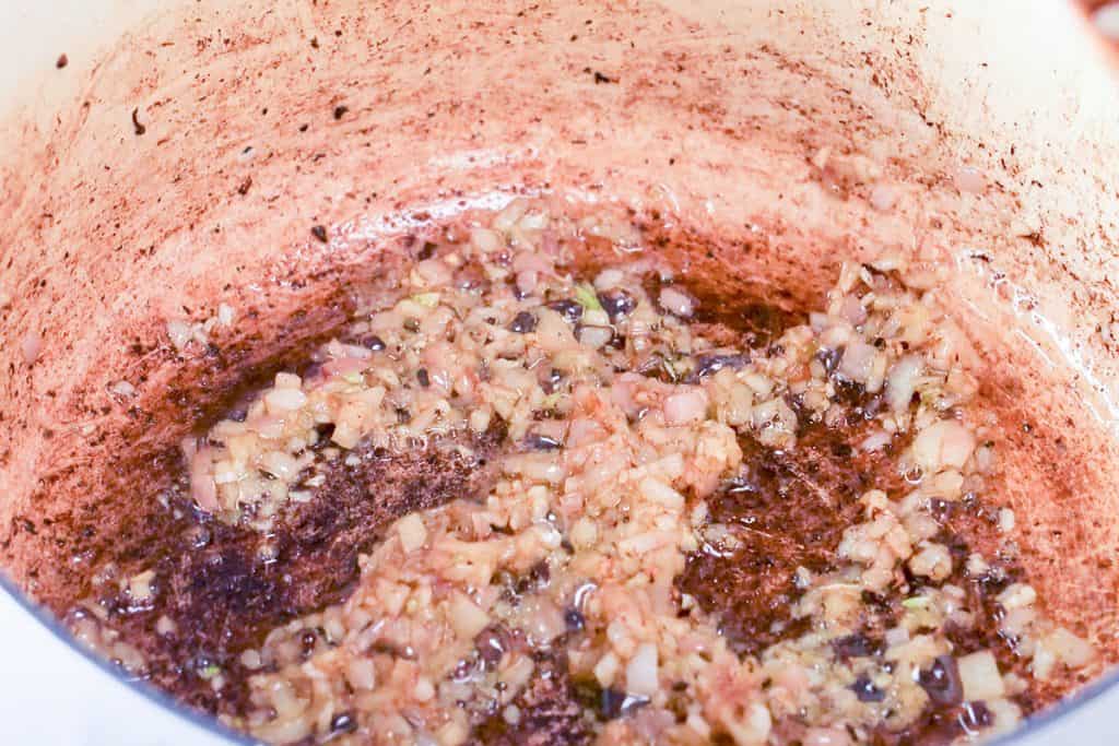 The shallots and garlic browning in the pan