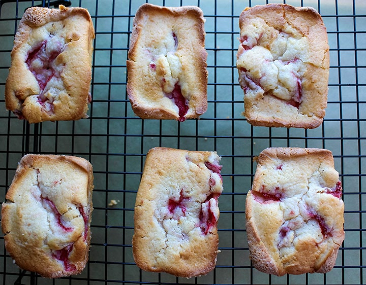 the baked cakes cooling on a cooling rack