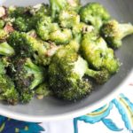 The roasted broccoli sprinkled with Parmesan cheese.