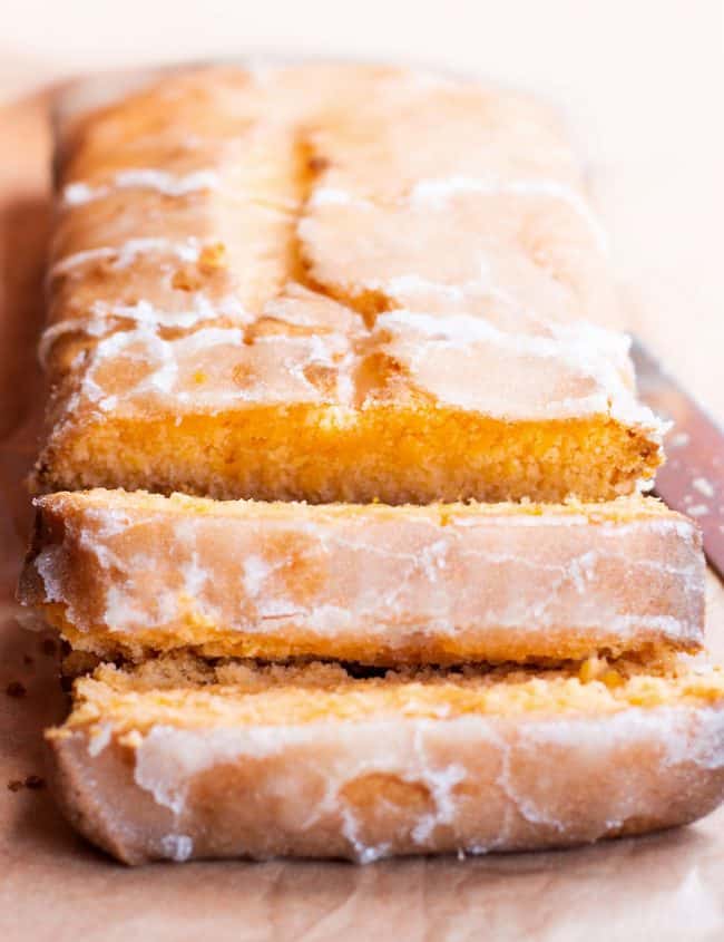 a tangerine loaf cake with drizzle icing sliced