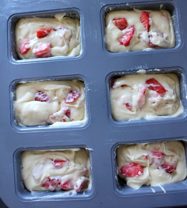 the batter added to the mini loaf pan ready to bake