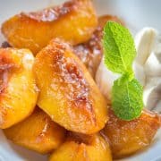 peaches and cream served with a sprig of mint for decoration