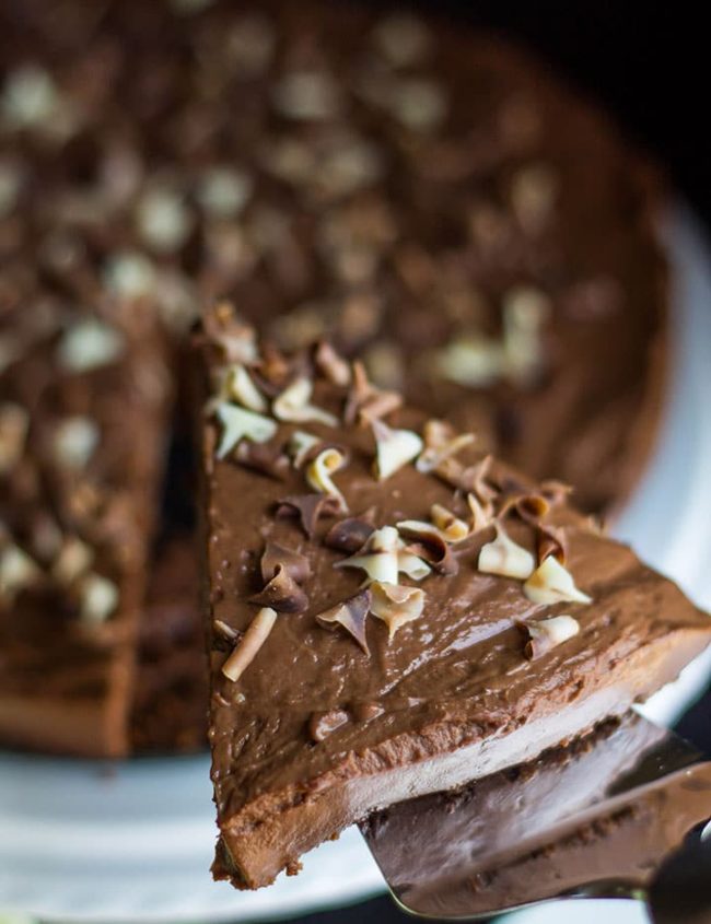 A slice of the Rich & Creamy No Bake Chocolate Torte being served
