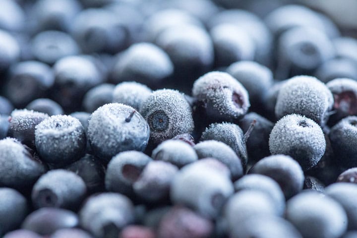 A close up of frozen blueberries