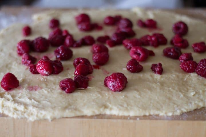 The dough topped with rasperries