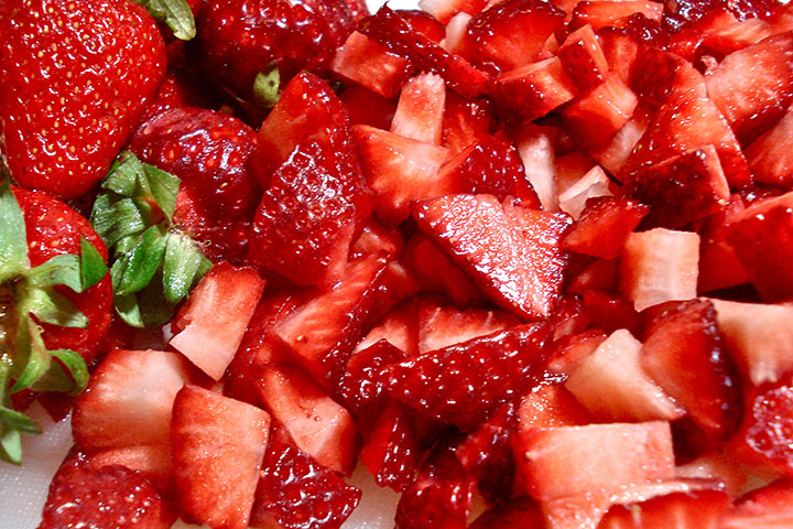 Diced strawberries on a chopping board