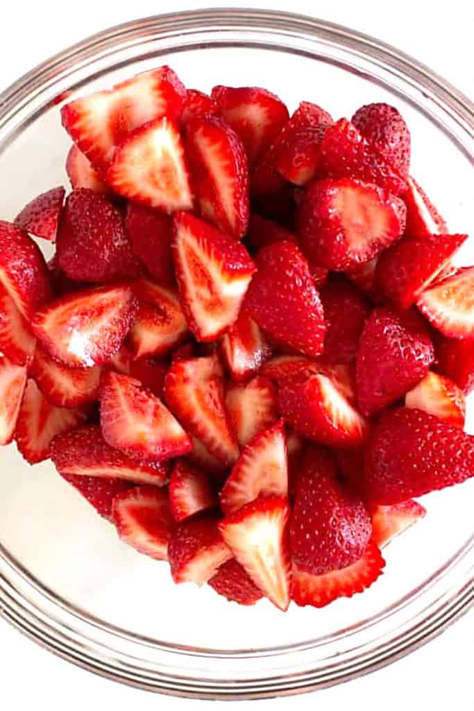 a bowl of sliced strawberries