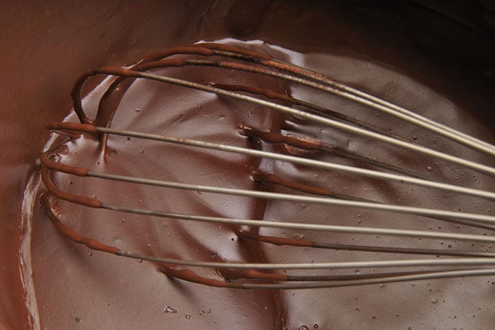 a whisk in the chocolate pots de creme mixture