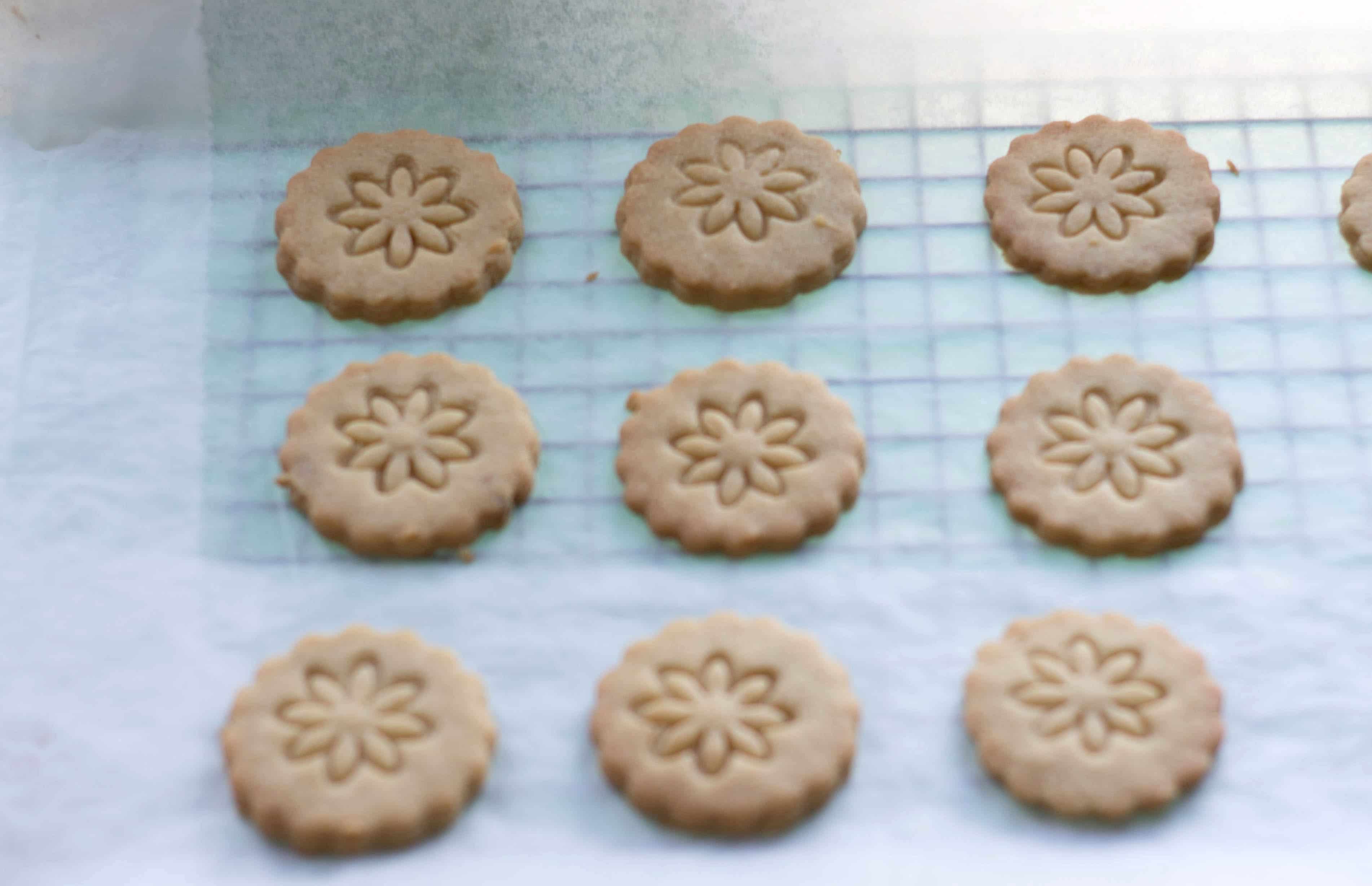 golden oreo cookies cooling on a tray