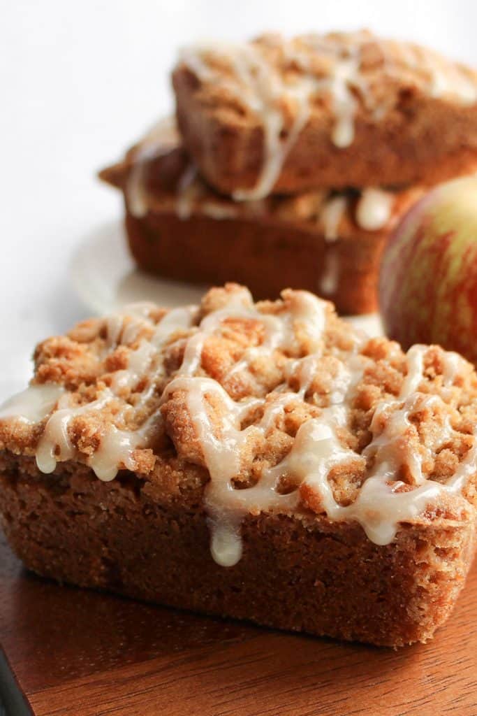 apple crumb cakes ready to eat with an apple in the background