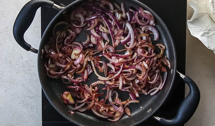 cooked red onions in a pan