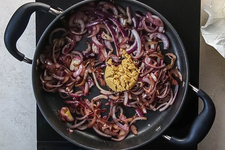 The brown sugar added to the pan with the red onions