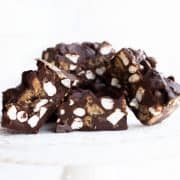 a cake stand piled with Rocky Road Candy Bars