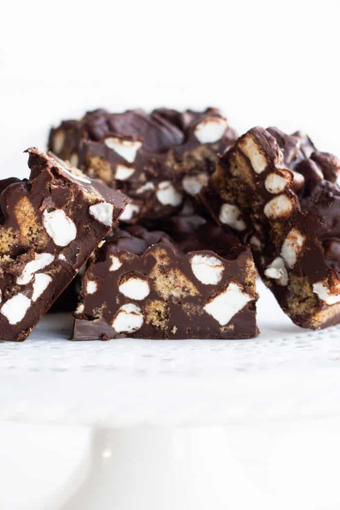 a cake stand piled with Rocky Road Candy Bars