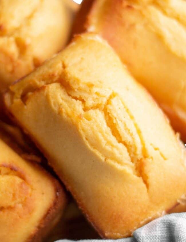 A close up sweet cornbread loaves in a basket