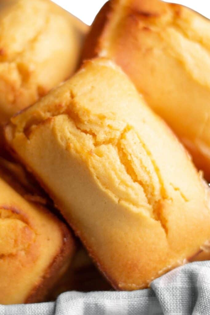 A close up sweet cornbread loaves in a basket