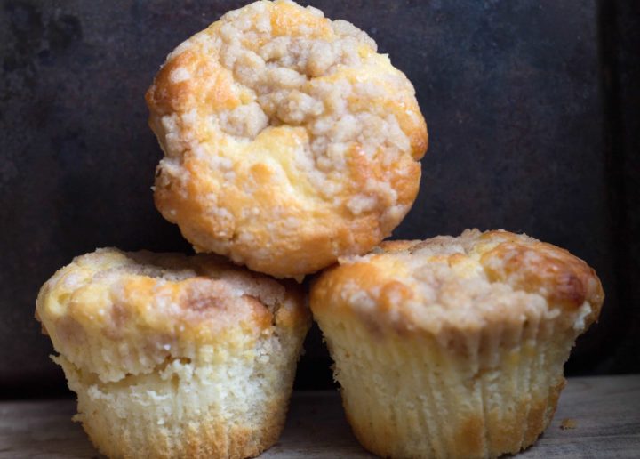 three apple cheesecake muffins stacked