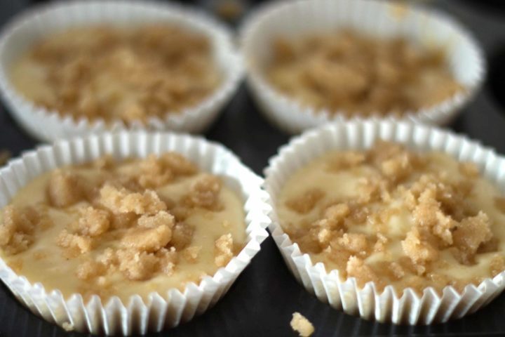 Apple Cheesecake Muffins batter topped with the crumb topping