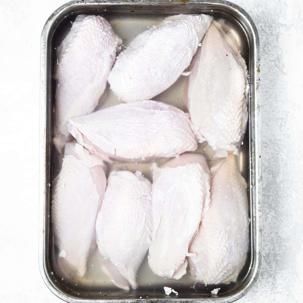 chicken breasts in a salt water brine