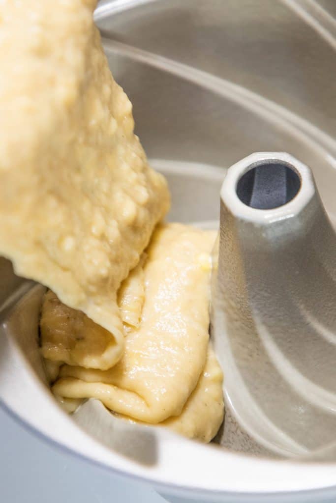 cake batter being poured into a pan