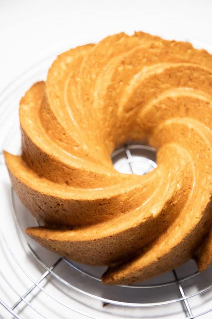 a freshly baked Bundt Cake on a cooling rack