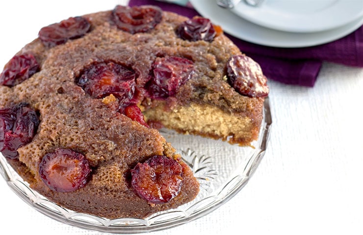 plum upside-down cake with a slice taken out