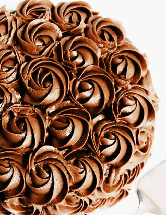 a cake covered in chocolate rosettes