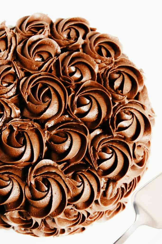 a cake covered in chocolate rosettes