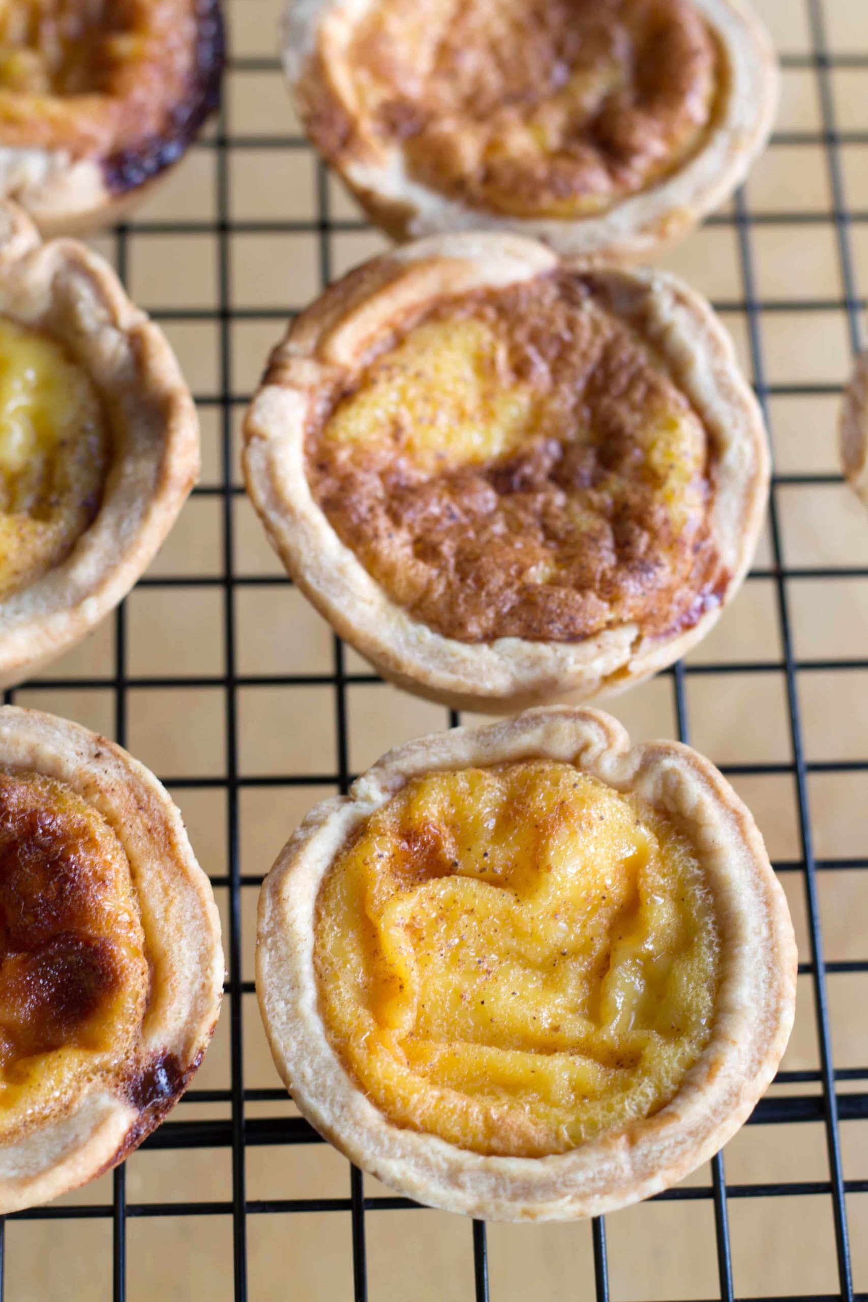 custard tarts on a wire rack