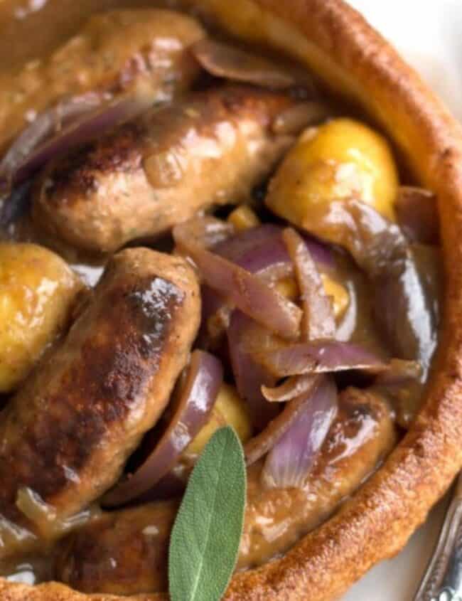 slow cooker apple sausage in onion gravy served in a Yorkshire pudding