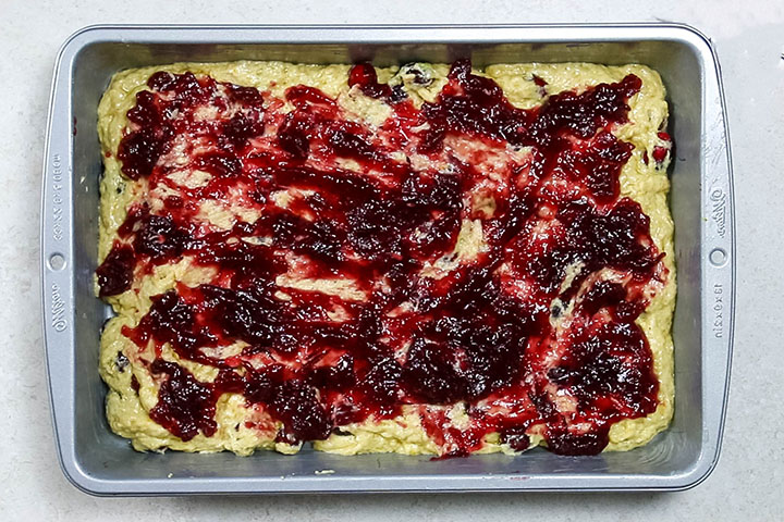 The cranberry jam spread over the top of the batter