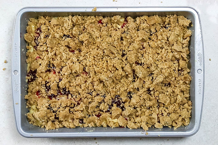 The crumb topping spread over the batter